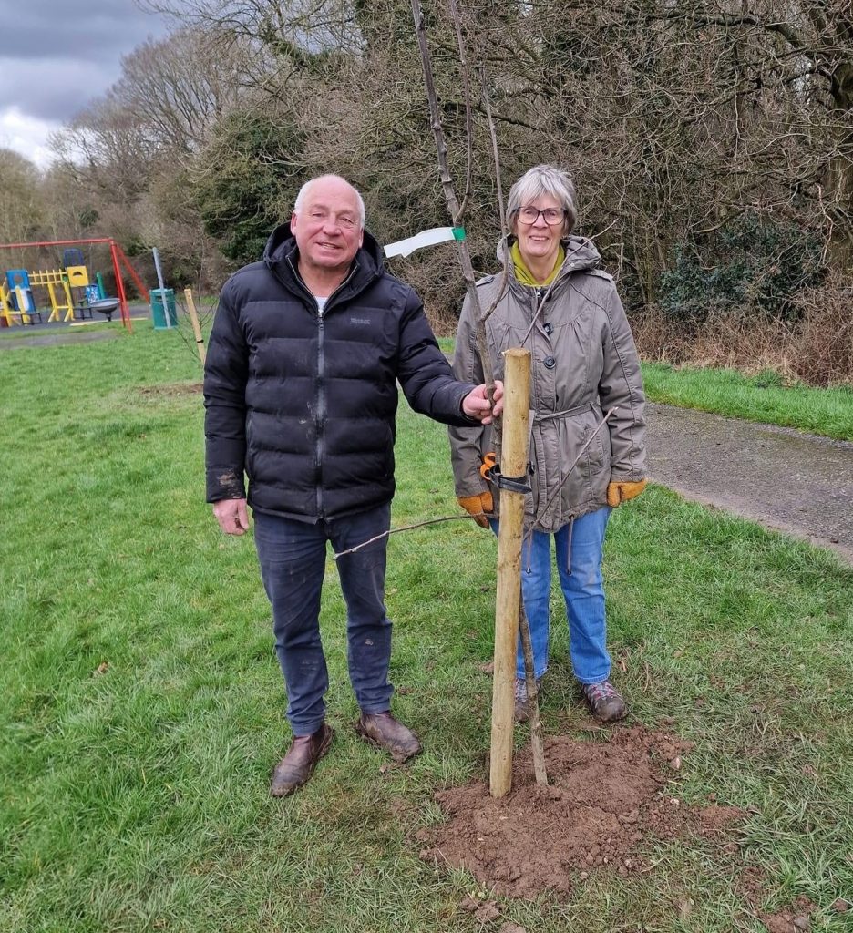 Photo of Councillor Moult and Mrs Barker Planting Trees at Hilary Crescent